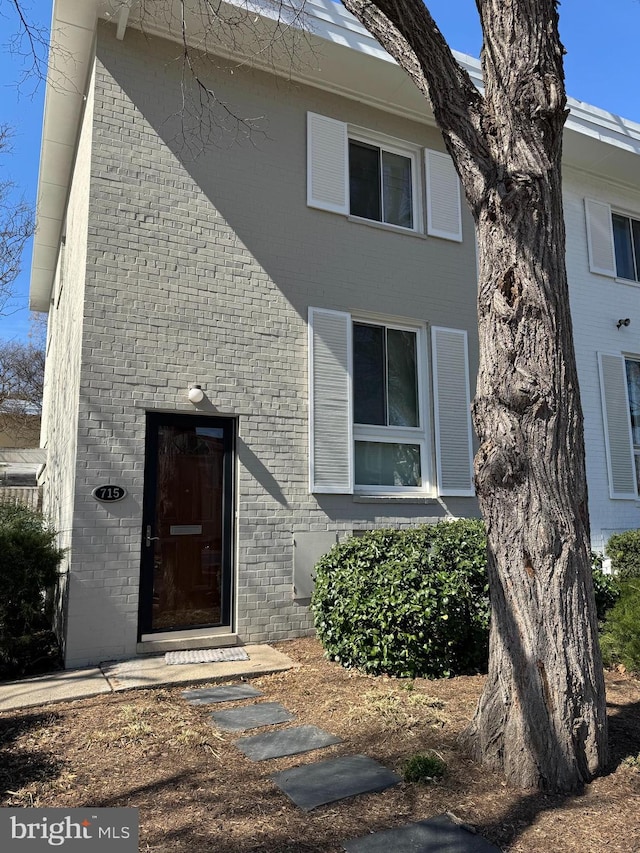 exterior space featuring brick siding