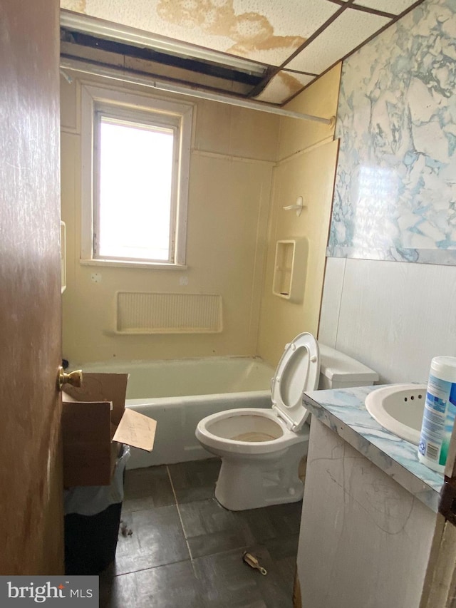 bathroom with toilet, bathtub / shower combination, and vanity