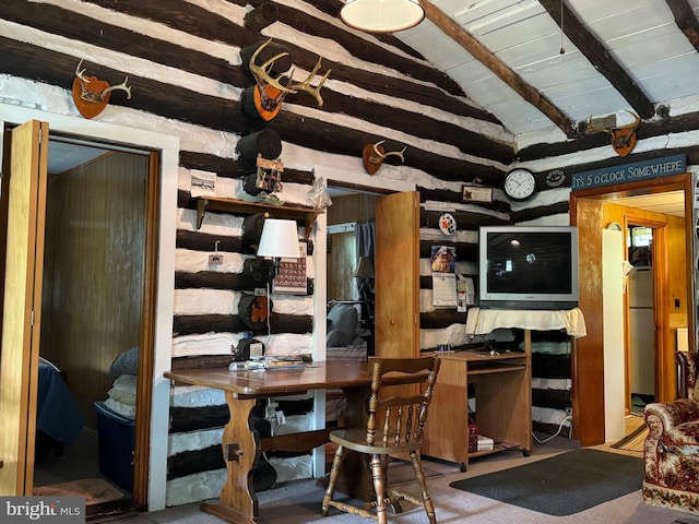 carpeted dining area with wood ceiling and vaulted ceiling with beams