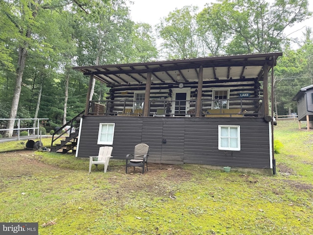 exterior space featuring stairway and log exterior