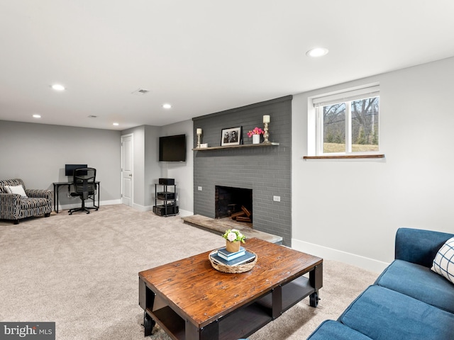 carpeted living room featuring visible vents, recessed lighting, a brick fireplace, and baseboards