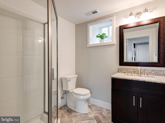 full bath featuring visible vents, a shower stall, baseboards, toilet, and vanity