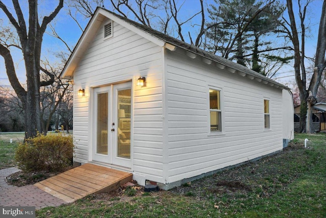 view of outbuilding featuring french doors