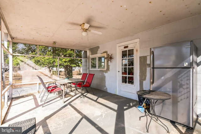 view of patio / terrace with outdoor dining area and ceiling fan