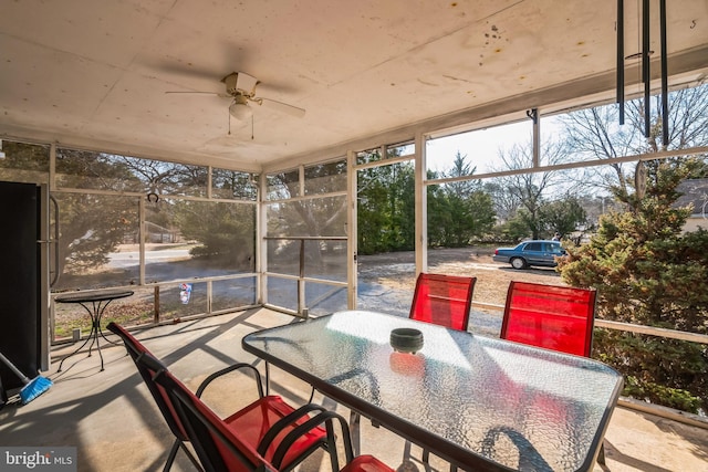 sunroom / solarium with a wealth of natural light and a ceiling fan