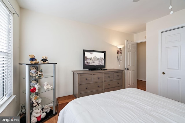 bedroom featuring wood finished floors