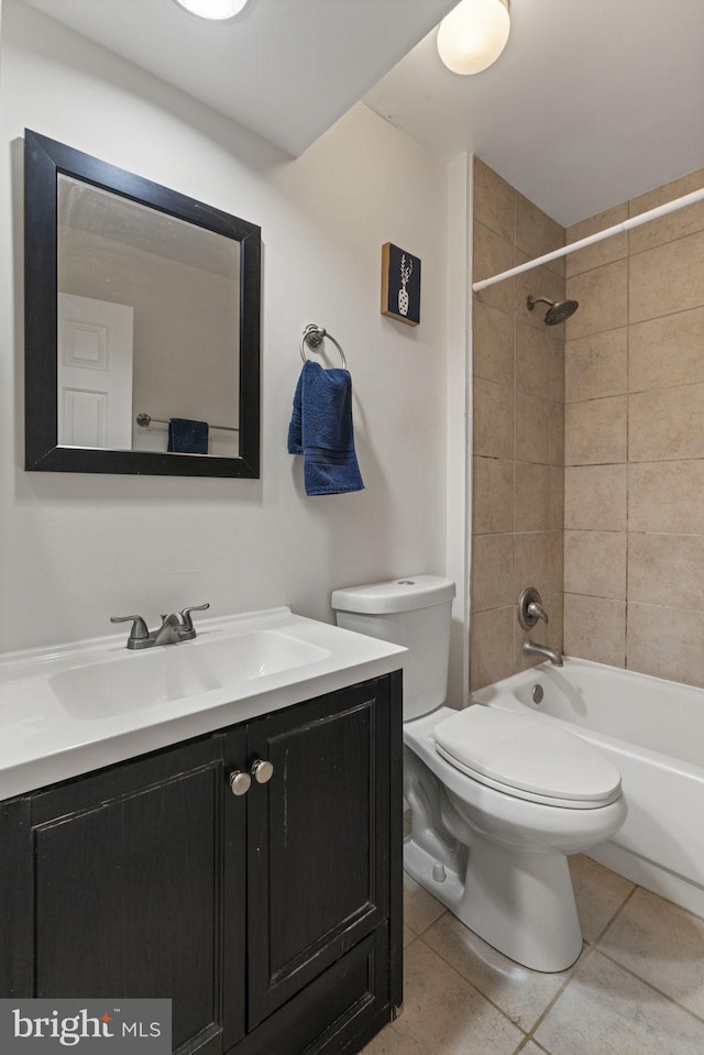 full bath with tile patterned flooring, shower / washtub combination, toilet, and vanity