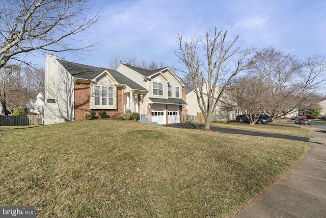 view of front of home featuring fence, an attached garage, a chimney, a front lawn, and brick siding