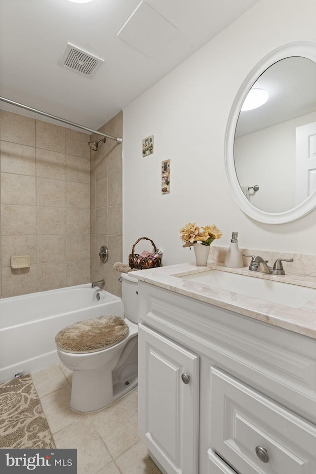 bathroom with vanity, visible vents, shower / washtub combination, tile patterned floors, and toilet