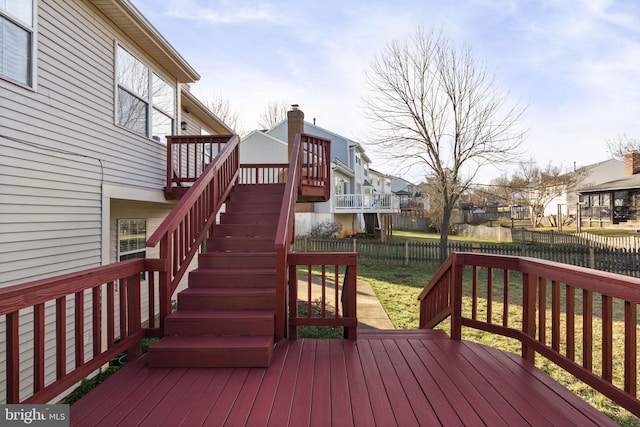 deck with a residential view, stairs, and a fenced backyard