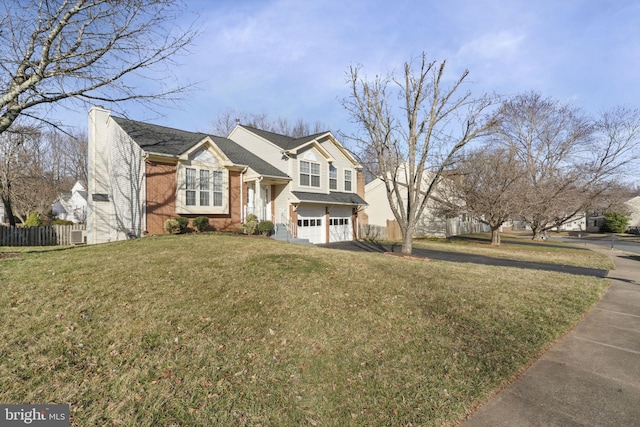 view of front of property featuring fence, a front yard, a garage, brick siding, and a chimney