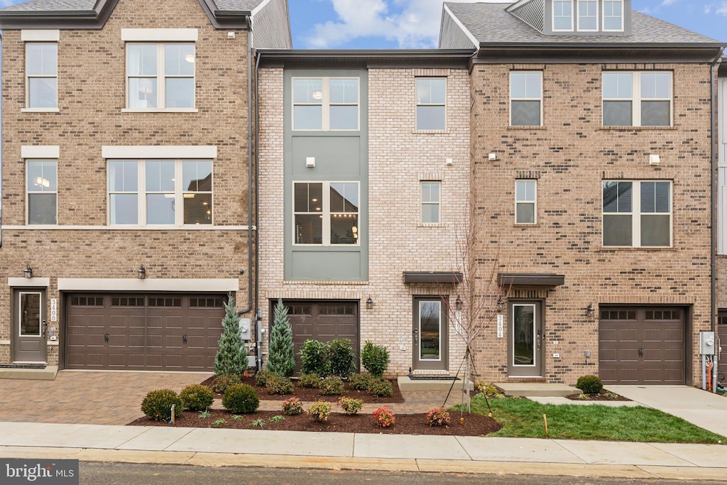 16918 Saint William Way, Bowie, MD 20716 - view of property with brick siding, an attached garage, and driveway