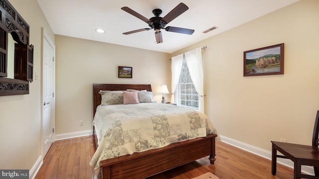 bedroom featuring visible vents, recessed lighting, baseboards, and wood finished floors