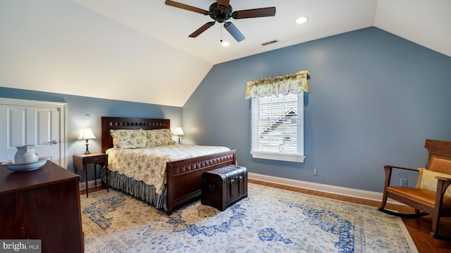 bedroom with visible vents, baseboards, vaulted ceiling, recessed lighting, and wood finished floors