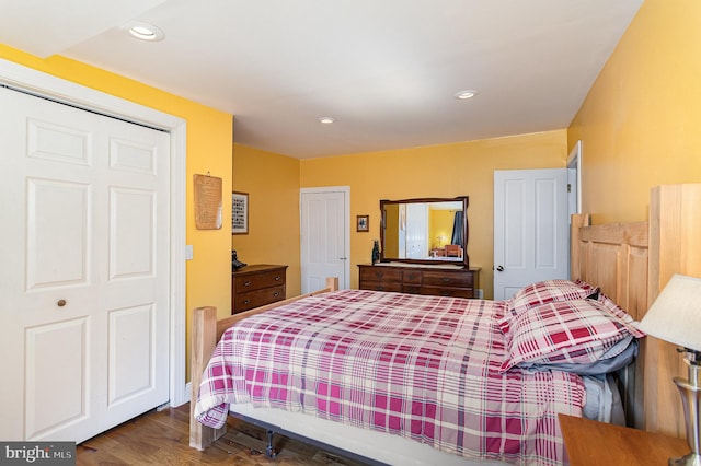 bedroom featuring recessed lighting and wood finished floors