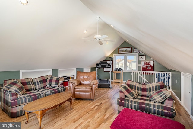 living room featuring light wood-style flooring, lofted ceiling, and ceiling fan