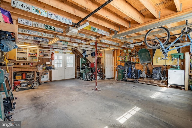 garage featuring a workshop area and a garage door opener