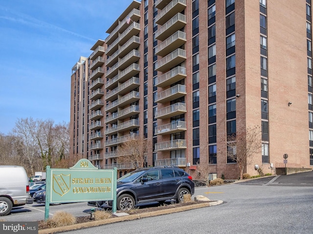 view of property with uncovered parking