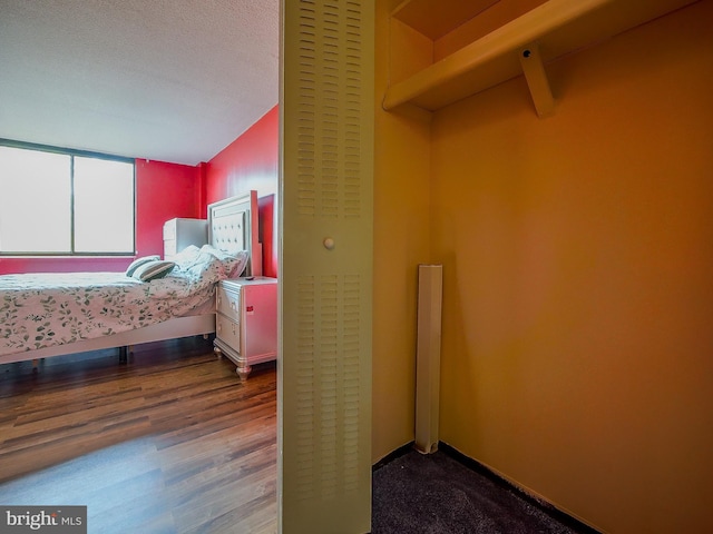 bedroom with wood finished floors