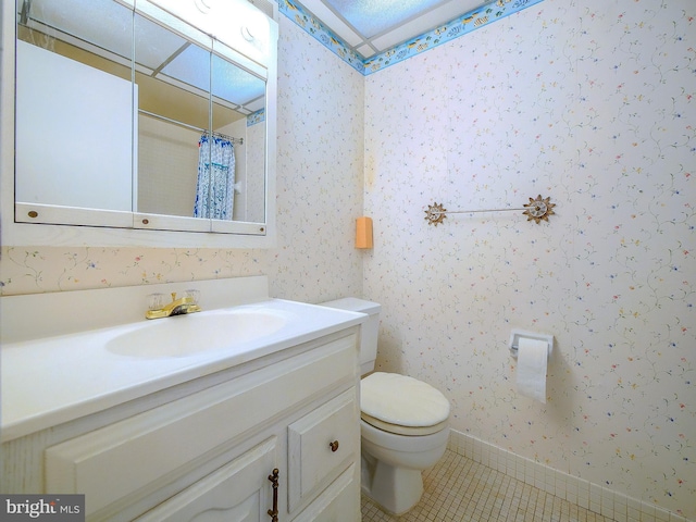 full bathroom featuring wallpapered walls, toilet, vanity, and tile patterned flooring