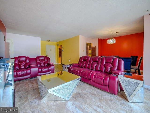 living room with a notable chandelier and a textured ceiling