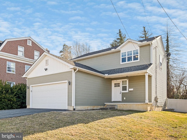 view of front facade featuring fence, aphalt driveway, a front yard, roof with shingles, and a garage