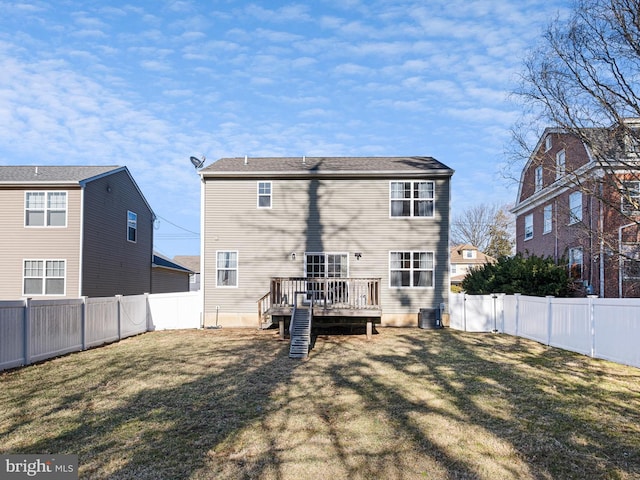 rear view of house featuring central AC, a lawn, a fenced backyard, and a wooden deck