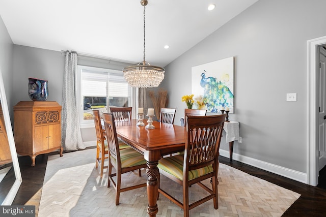 dining room featuring a notable chandelier, wood finished floors, recessed lighting, baseboards, and vaulted ceiling