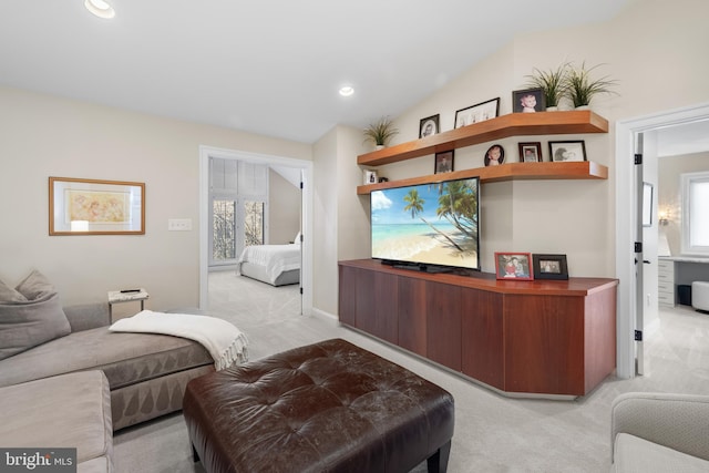 living room with light carpet, plenty of natural light, recessed lighting, and vaulted ceiling