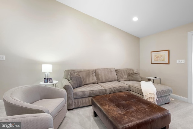 living room featuring recessed lighting, baseboards, and light colored carpet