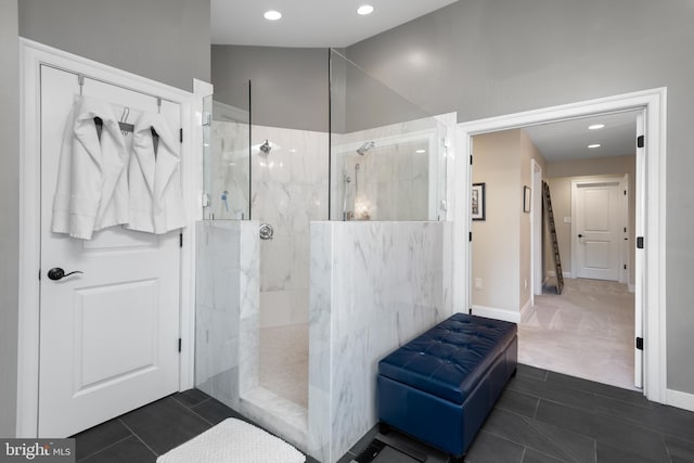 full bathroom featuring tile patterned floors, lofted ceiling, a walk in shower, recessed lighting, and baseboards