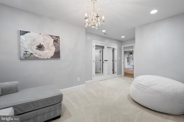 living area featuring baseboards, carpet floors, an inviting chandelier, recessed lighting, and french doors