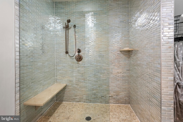 full bathroom with tiled shower