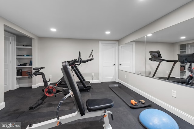 workout room with recessed lighting and baseboards