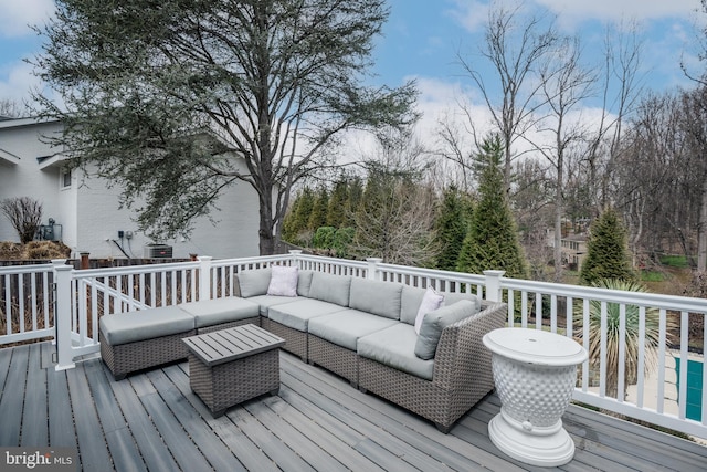 wooden deck featuring an outdoor hangout area