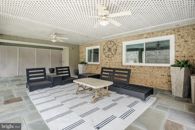 exterior space with outdoor lounge area and ceiling fan