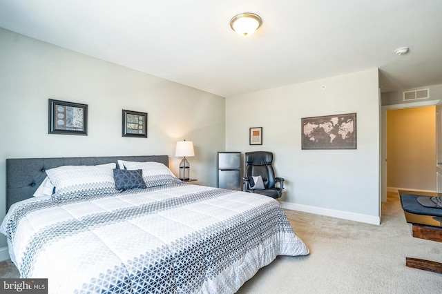 bedroom featuring visible vents, baseboards, and carpet