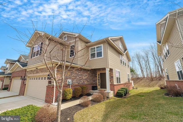 view of front of home with driveway, central AC, a front yard, a garage, and brick siding