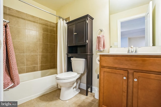 bathroom with vanity, baseboards, shower / tub combo, tile patterned floors, and toilet