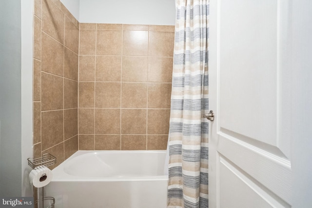 bathroom with shower / bath combination with curtain