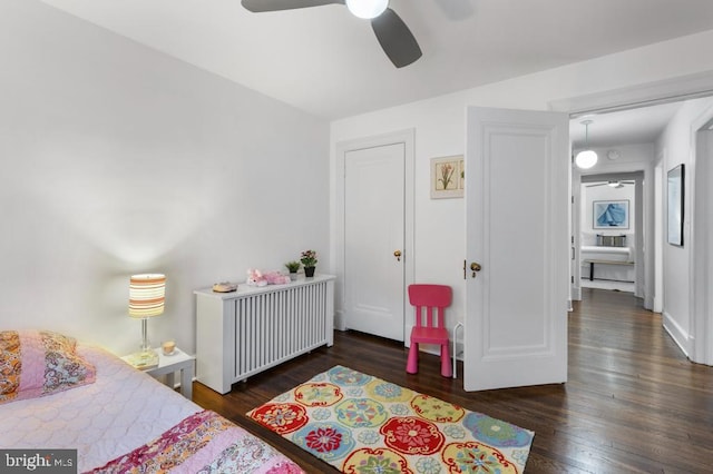 bedroom with wood finished floors and ceiling fan