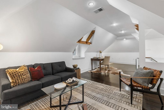 living area featuring visible vents, wood finished floors, recessed lighting, baseboards, and vaulted ceiling