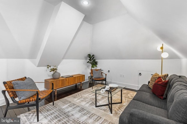 living area featuring vaulted ceiling, recessed lighting, wood finished floors, and baseboards