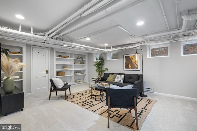 living area with baseboards, carpet floors, and baseboard heating