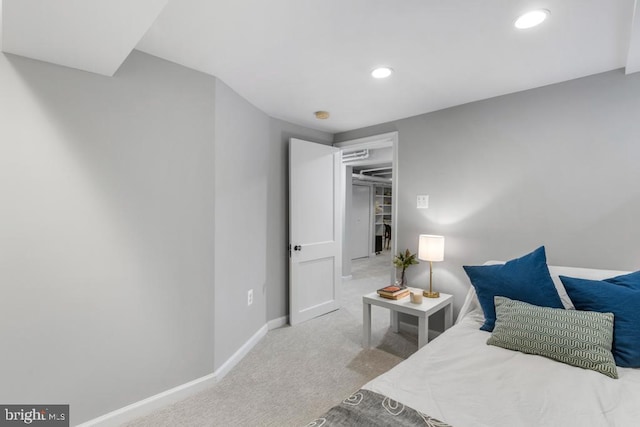 carpeted bedroom featuring recessed lighting and baseboards