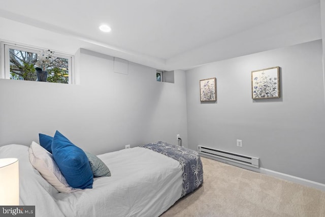 carpeted bedroom featuring recessed lighting and baseboard heating