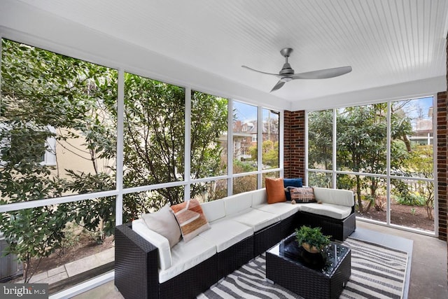 sunroom with plenty of natural light and a ceiling fan