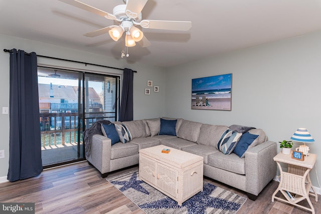 living area featuring wood finished floors and a ceiling fan