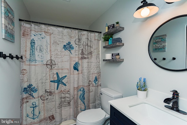 full bathroom featuring curtained shower, toilet, and vanity