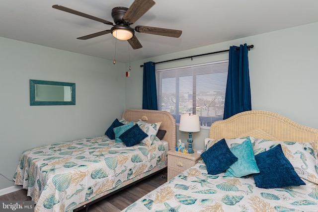 bedroom with ceiling fan and wood finished floors